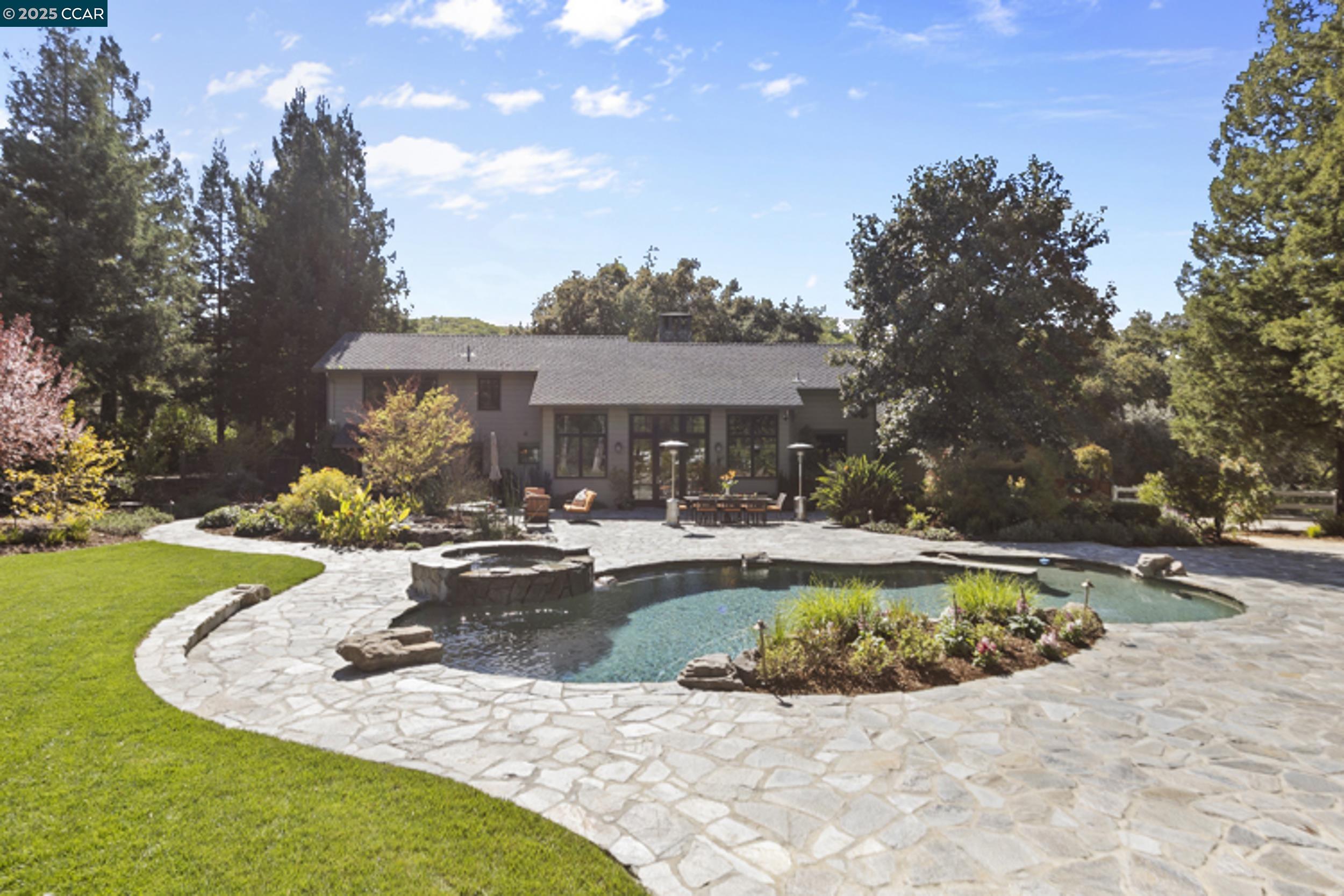 350 Pine Creek Road Walnut Creek, CA 94598 - Photo 42 of 59 a view of a house with swimming pool and sitting area