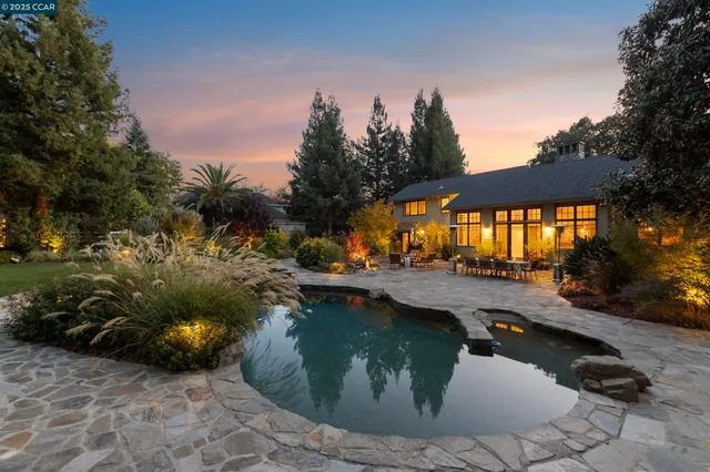 a view of a house with a yard and plants