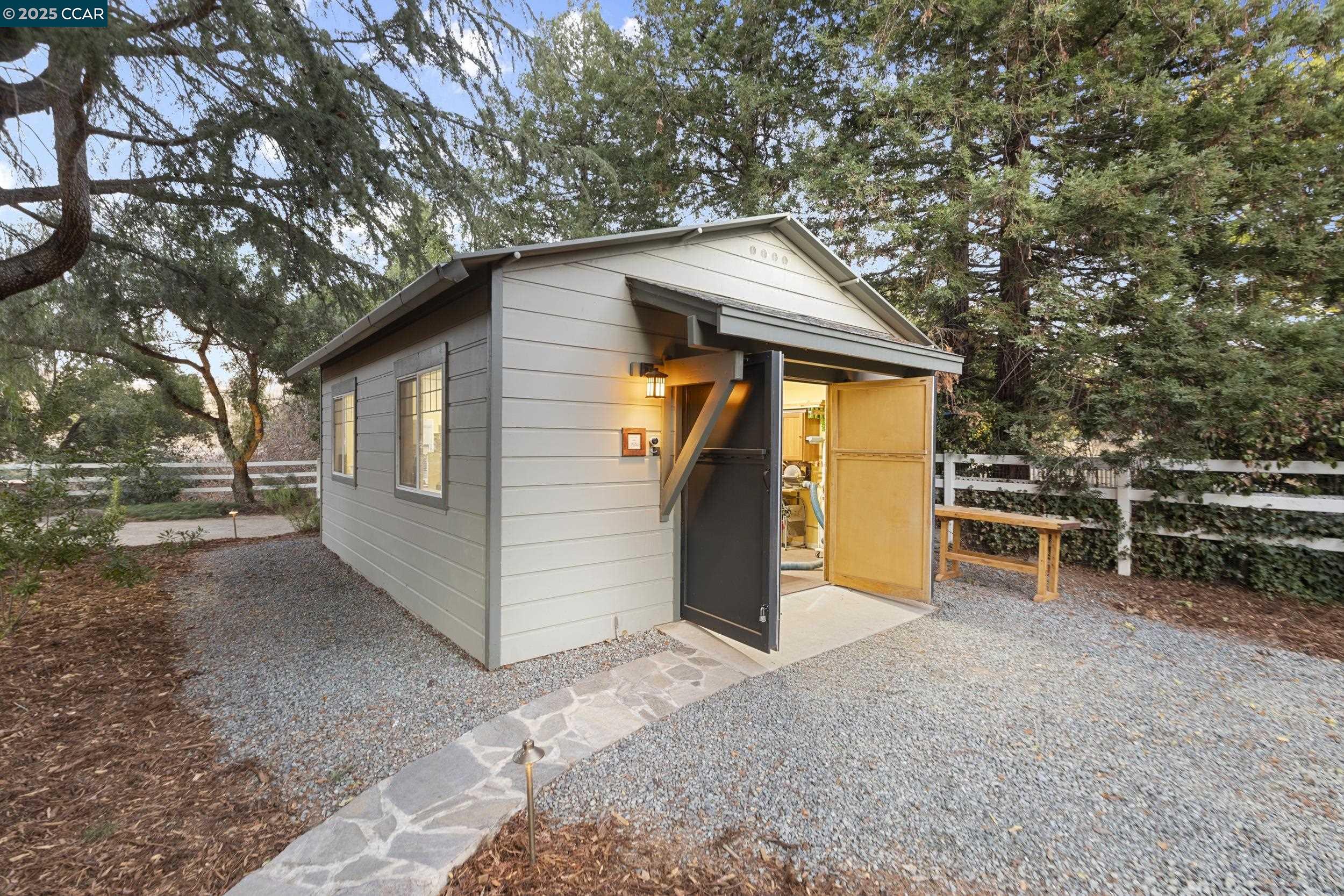 350 Pine Creek Road Walnut Creek, CA 94598 - Photo 52 of 59 a view of a house with a large tree and a yard