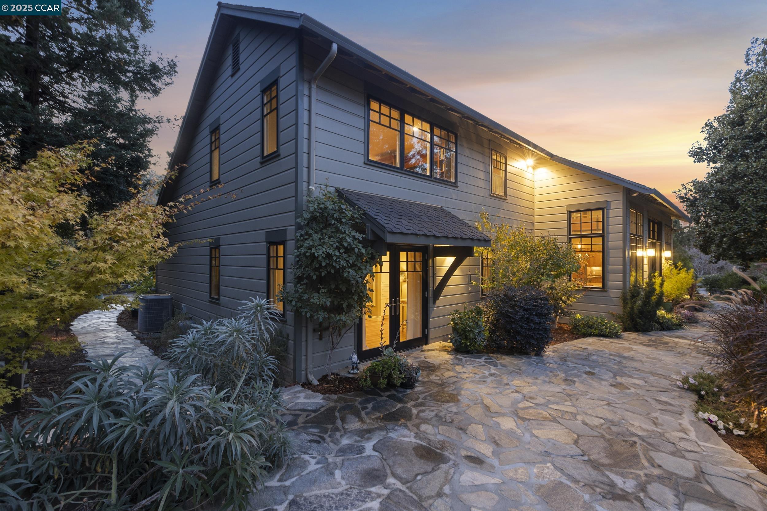 350 Pine Creek Road Walnut Creek, CA 94598 - Photo 56 of 59 a view of a house with brick walls and floor to ceiling windows