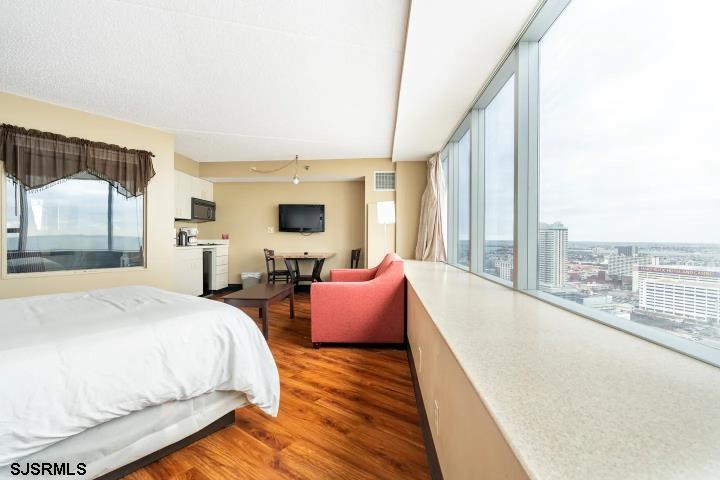 1515 Boardwalk, Unit 2704 Atlantic City, NJ 08401 - Photo 15 of 15 a spacious bedroom with a bed and glass windows