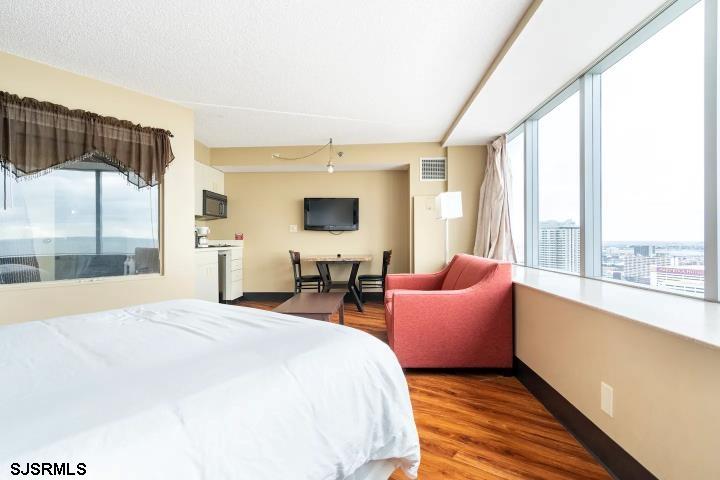 1515 Boardwalk, Unit 2704 Atlantic City, NJ 08401 - Photo 6 of 15 a bedroom with furniture and large windows