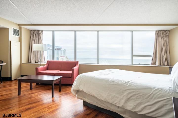 1515 Boardwalk, Unit 2704 Atlantic City, NJ 08401 - Photo 7 of 15 a bedroom with a bed and a large window
