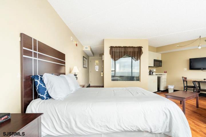 1515 Boardwalk, Unit 2704 Atlantic City, NJ 08401 - Photo 10 of 15 a bedroom with a bed and a flat tv screen