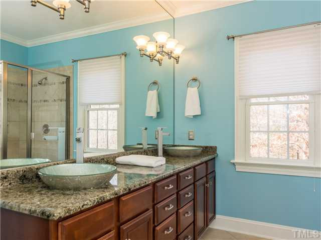 8677 Barrett Ridge Road Wake Forest, NC 27587 - Photo 13 of 25 The master bath has a dual vanity, granite counters and tile floor. Two people can easily get ready at once in this wonderful space! Master Bath/Spa