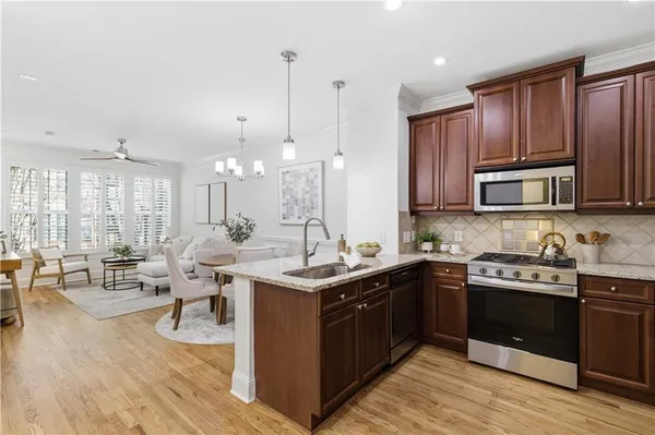 a spacious bathroom with a granite countertop sink a mirror and a vanity