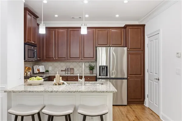 a kitchen with a sink cabinets and stainless steel appliances