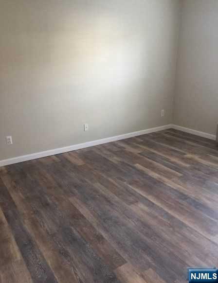 2 Richmond Road, Unit 110 West Milford, NJ 07480 - Photo 13 of 45 a view of an empty room with wooden floor