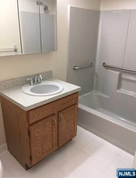 2 Richmond Road, Unit 110 West Milford, NJ 07480 - Photo 17 of 45 a bathroom with a sink and a bathtub
