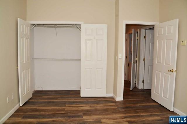 2 Richmond Road, Unit 110 West Milford, NJ 07480 - Photo 20 of 45 a view of an empty room with wooden floor and a bathroom