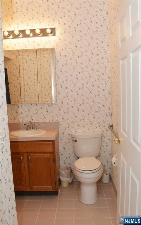 2 Richmond Road, Unit 110 West Milford, NJ 07480 - Photo 24 of 45 a bathroom with a toilet and a sink