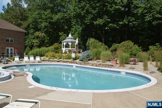 2 Richmond Road, Unit 110 West Milford, NJ 07480 - Photo 33 of 45 a view of a swimming pool and a chairs