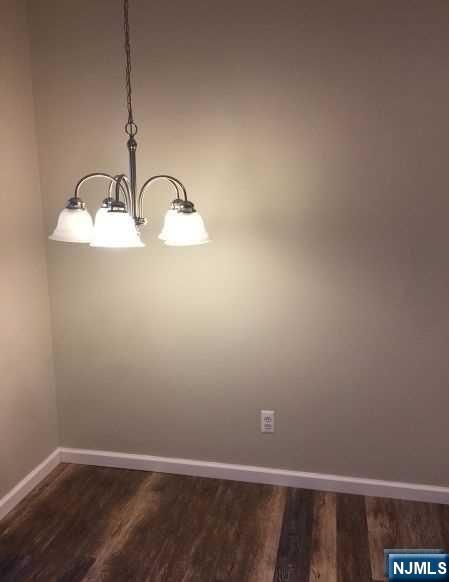 2 Richmond Road, Unit 110 West Milford, NJ 07480 - Photo 8 of 45 a room with a wooden floor and a window