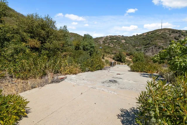 a view of a beach with a snow in the background
