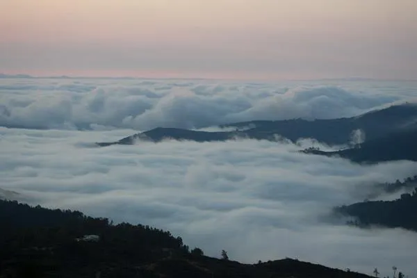 a aerial view of a house with a yard and sitting area