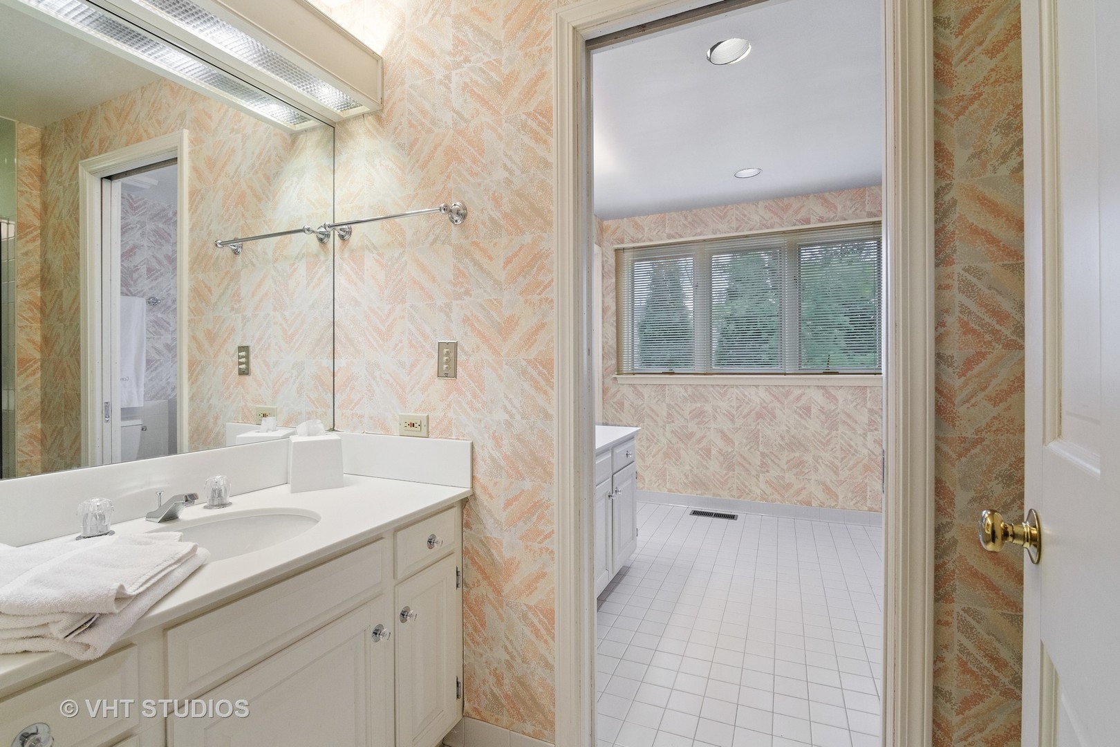 1122 Mohawk Road Wilmette, IL 60091 - Photo 16 of 23 a bathroom with a double vanity sink and mirror