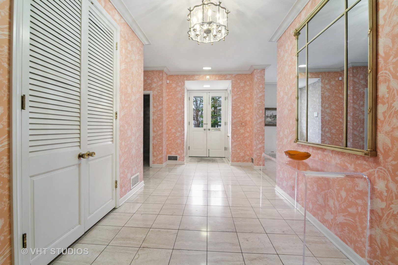 1122 Mohawk Road Wilmette, IL 60091 - Photo 4 of 23 a view of a hallway with windows and chandelier