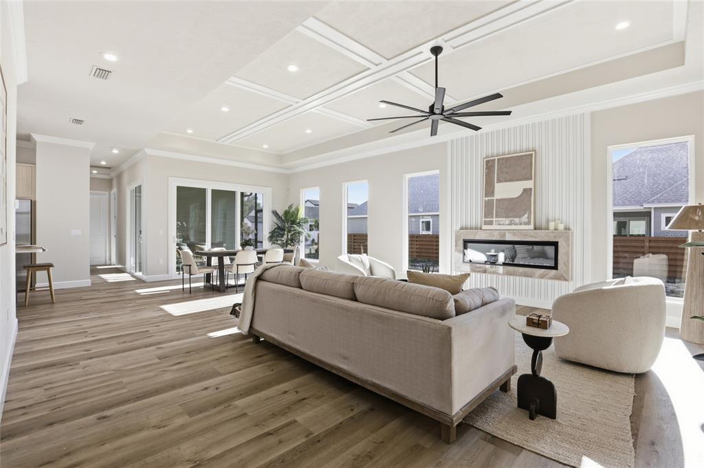 13425 Southwest 9th Road Newberry, FL 32669 - Photo 39 of 46 a living room with furniture a fireplace and a chandelier