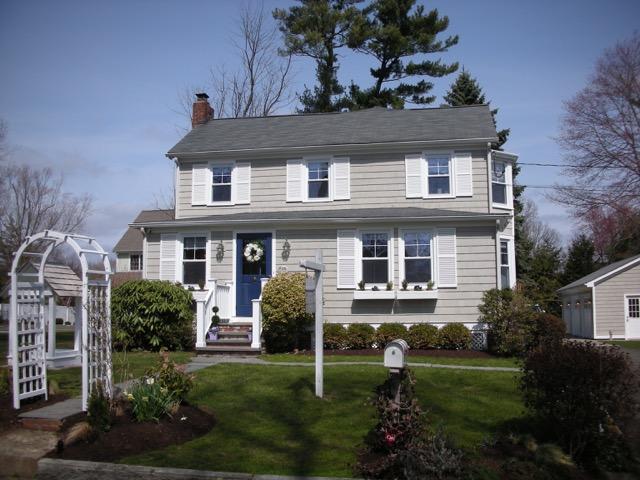 67 Relihan Road Darien, CT 06820 - Photo 1 of 25 a front view of a house with a yard and garage