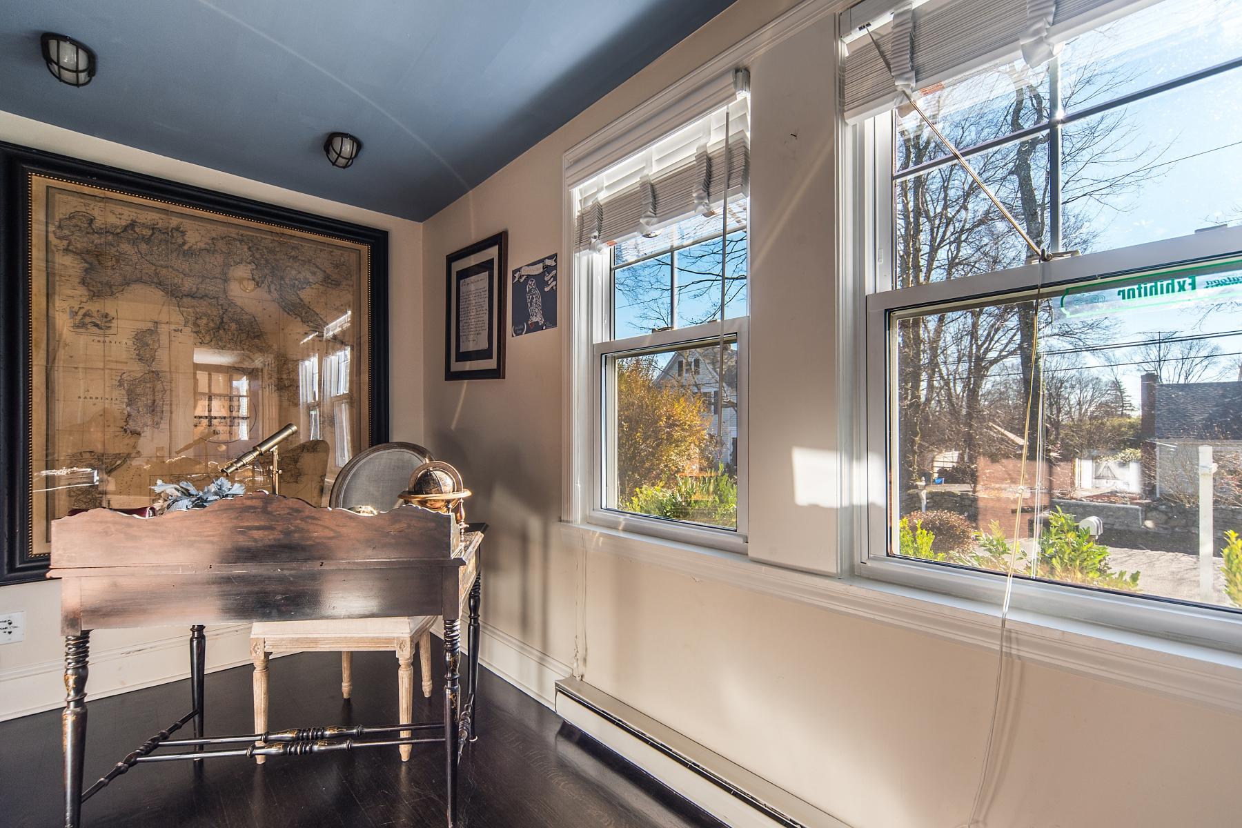 67 Relihan Road Darien, CT 06820 - Photo 13 of 25 a living room with furniture and a large window