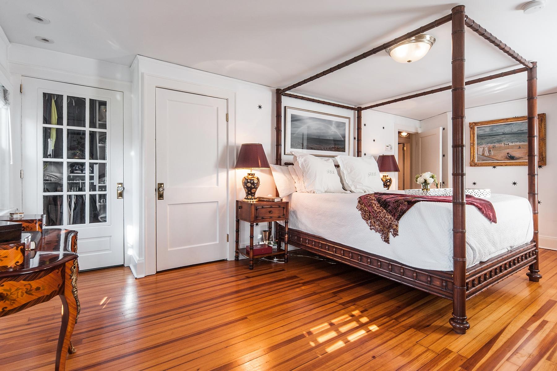 67 Relihan Road Darien, CT 06820 - Photo 14 of 25 a large bed sitting in a spacious bedroom next to a window