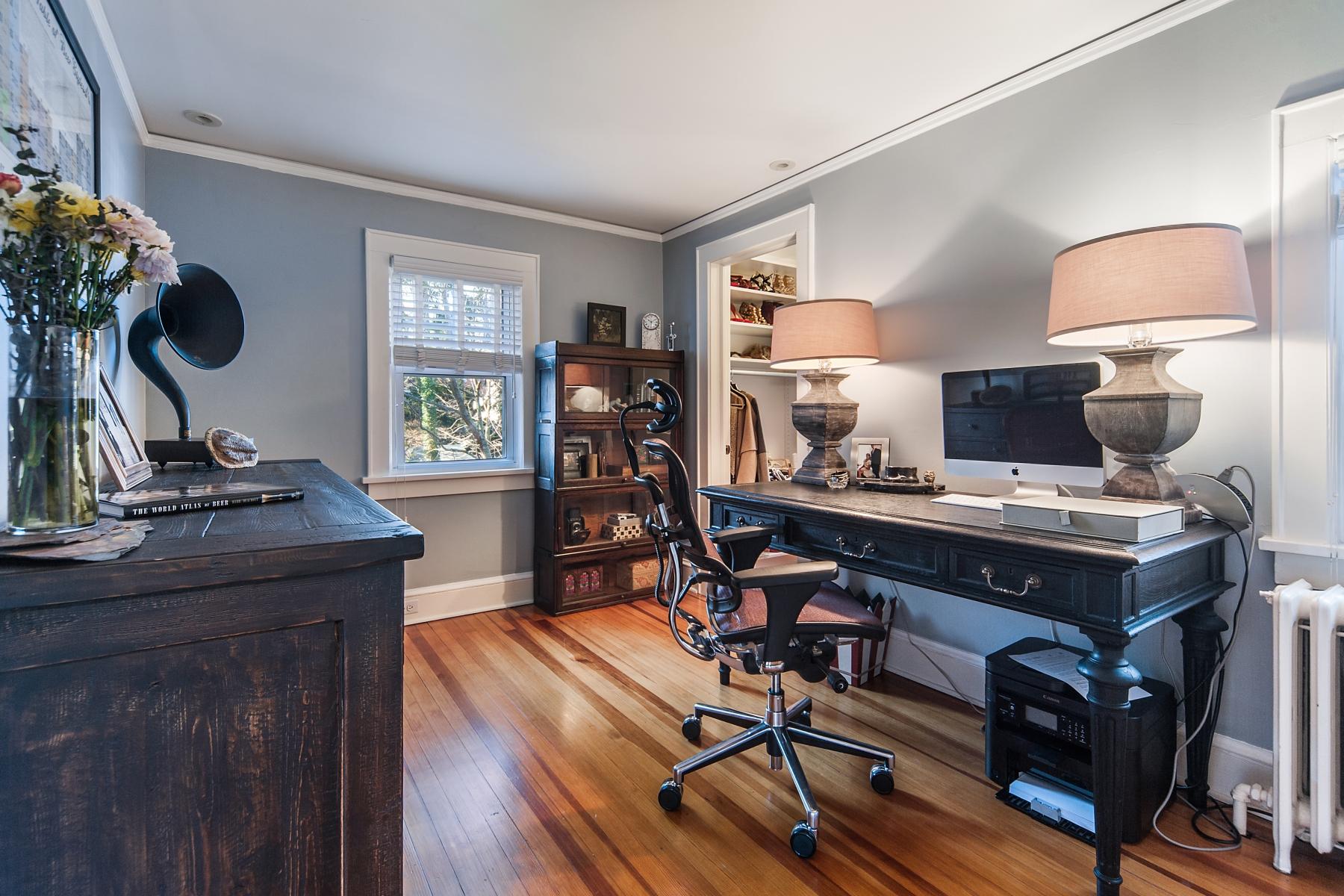 67 Relihan Road Darien, CT 06820 - Photo 16 of 25 a view of a workspace with furniture and a window
