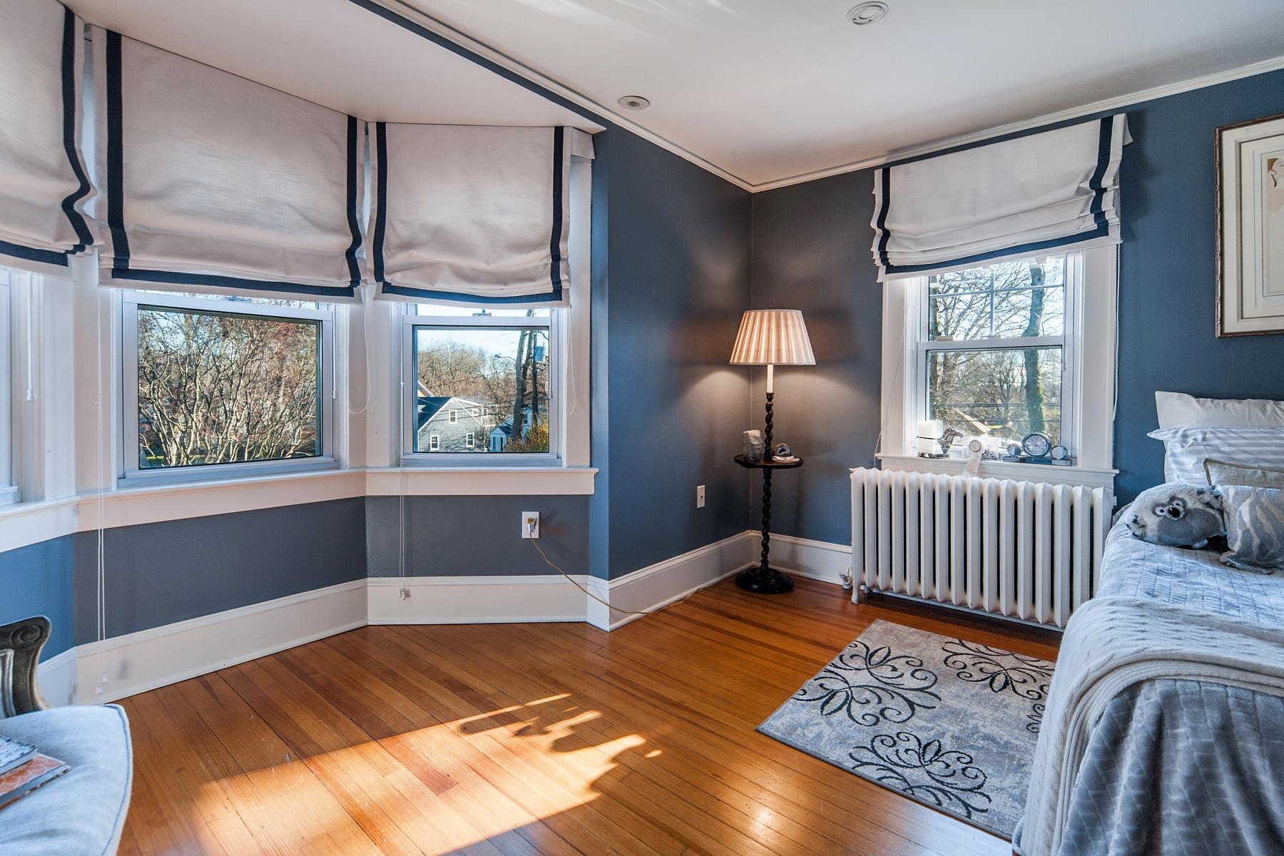 67 Relihan Road Darien, CT 06820 - Photo 17 of 25 a bedroom with a bed and a window
