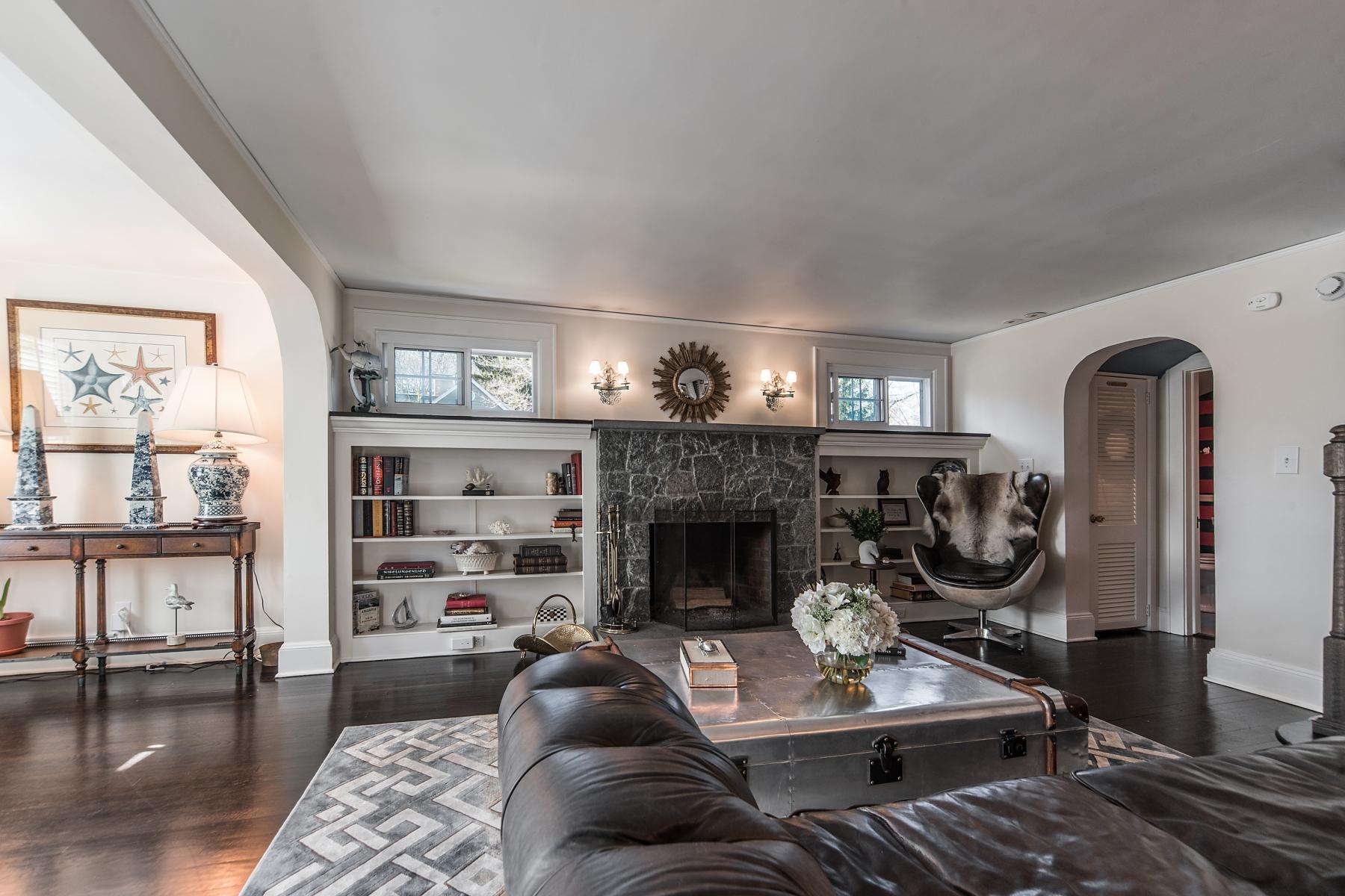 67 Relihan Road Darien, CT 06820 - Photo 2 of 25 a living room with furniture a fireplace a rug and wooden floor