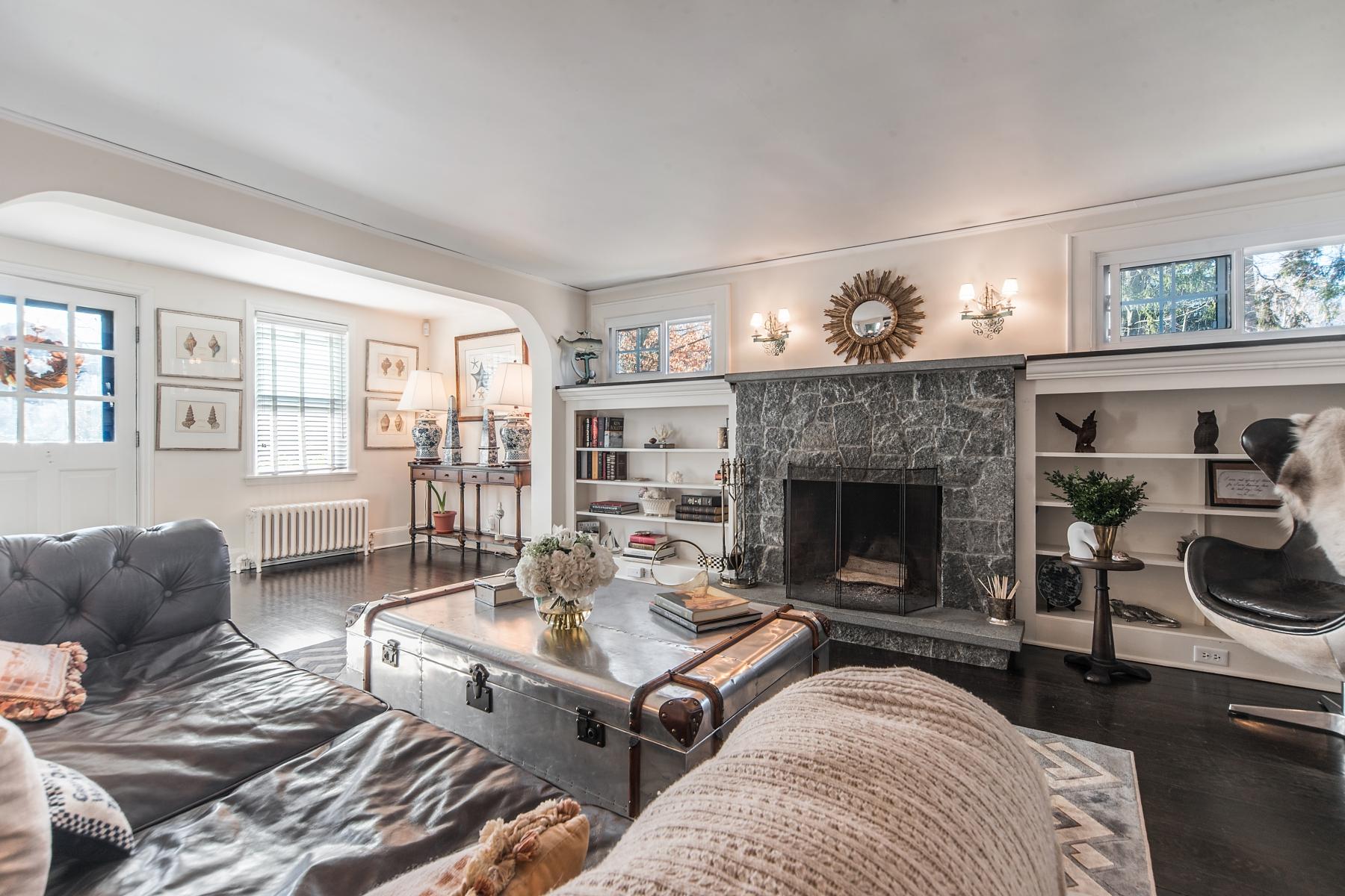 67 Relihan Road Darien, CT 06820 - Photo 3 of 25 a living room with furniture and a fireplace