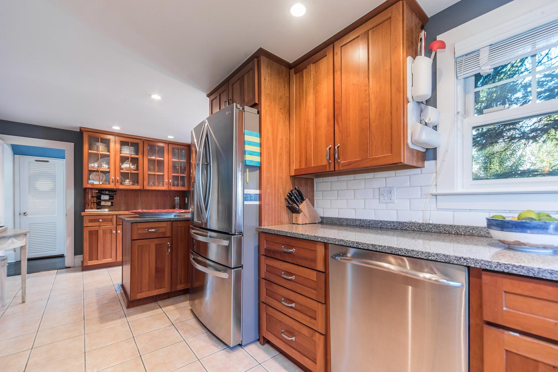 67 Relihan Road Darien, CT 06820 - Photo 8 of 25 a kitchen with stainless steel appliances granite countertop a refrigerator and a sink