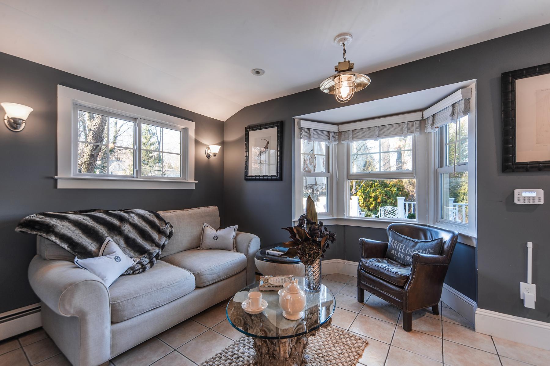 67 Relihan Road Darien, CT 06820 - Photo 9 of 25 a living room with furniture and a large window