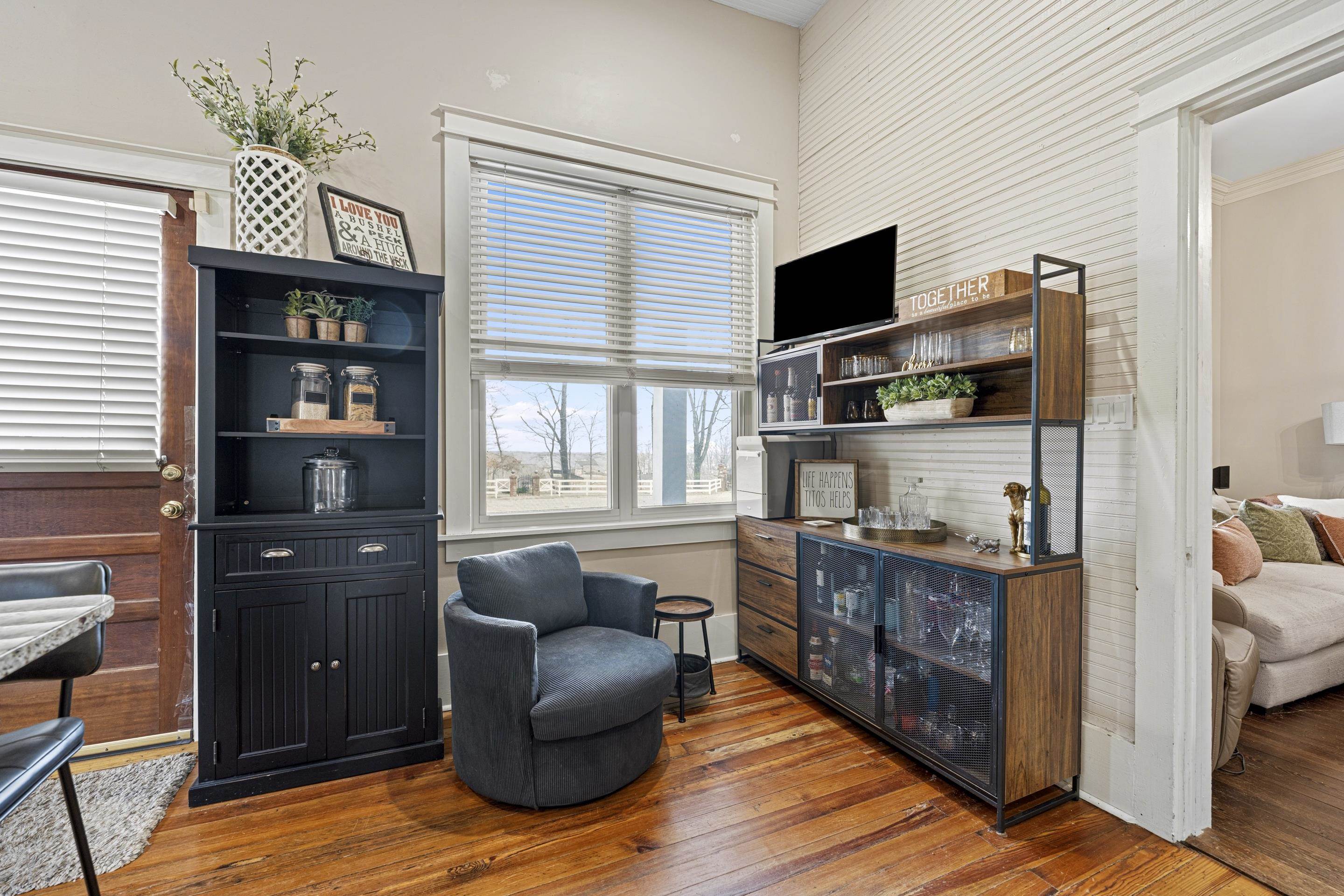 12601 Harrell Road Arlington, TN 38002 - Photo 25 of 40 a living room with furniture a flat screen tv and a window