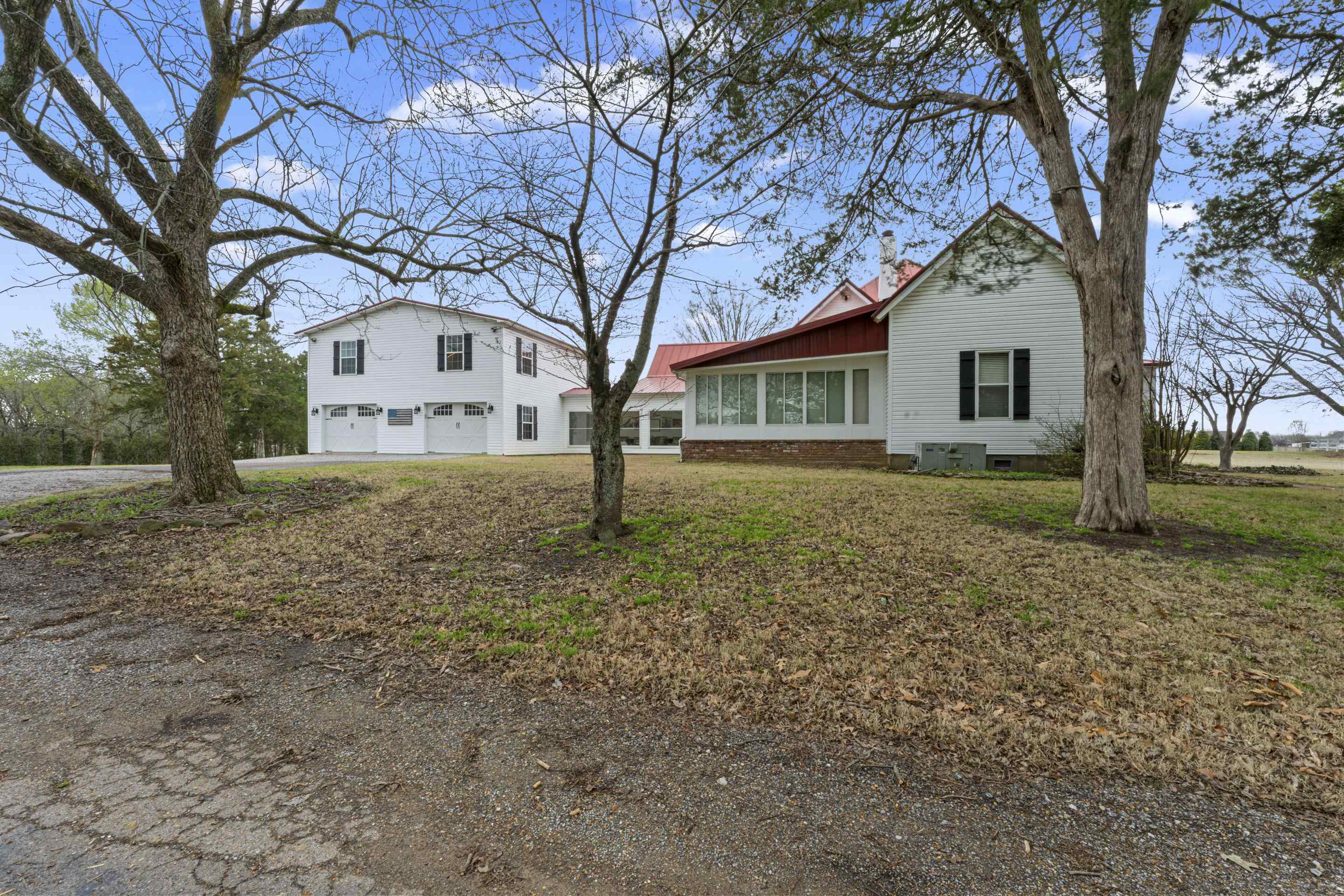 12601 Harrell Road Arlington, TN 38002 - Photo 30 of 40 a front view of a house with a yard and trees