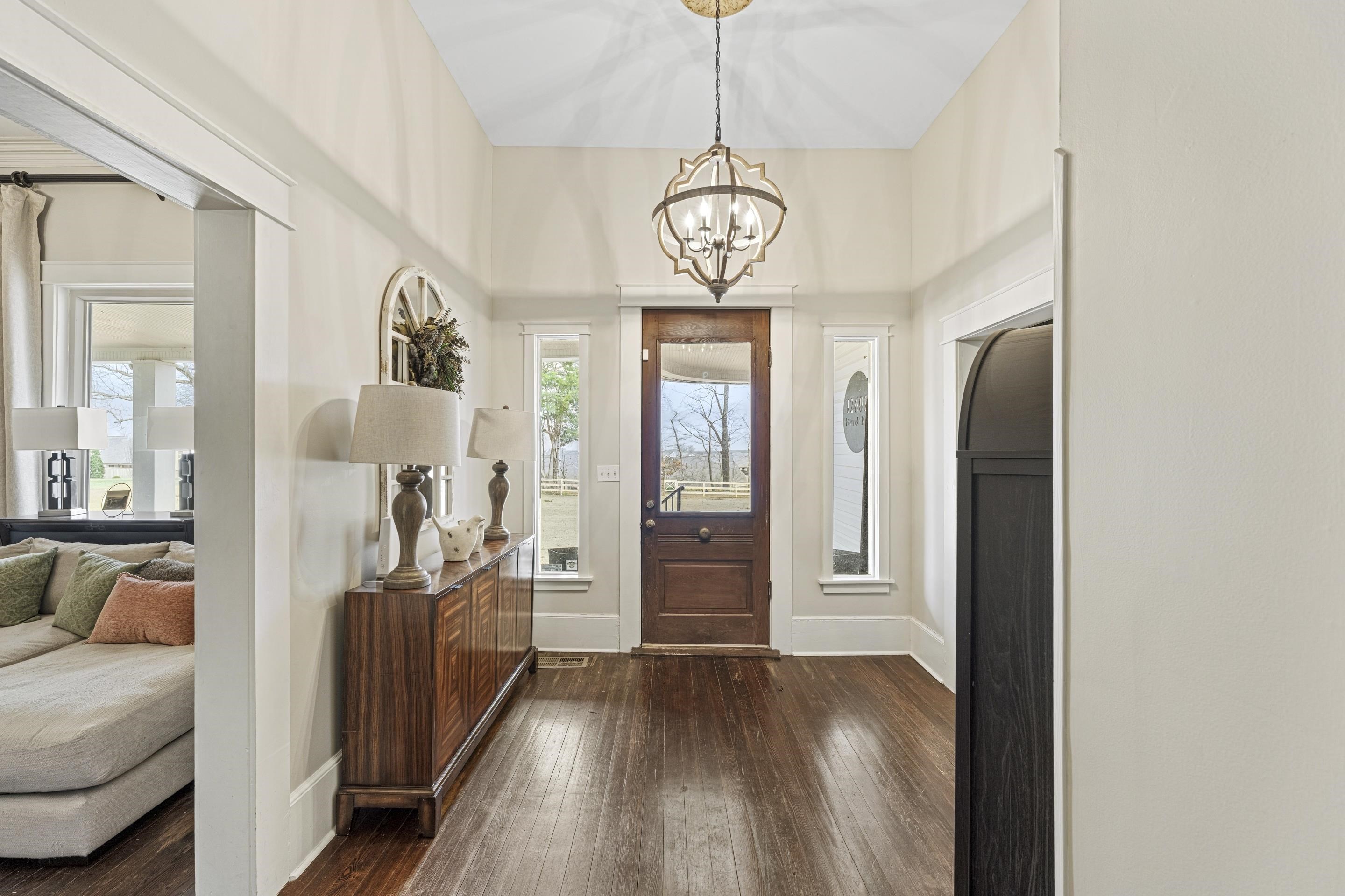 12601 Harrell Road Arlington, TN 38002 - Photo 5 of 40 a view of a livingroom with furniture wooden floor a chandelier