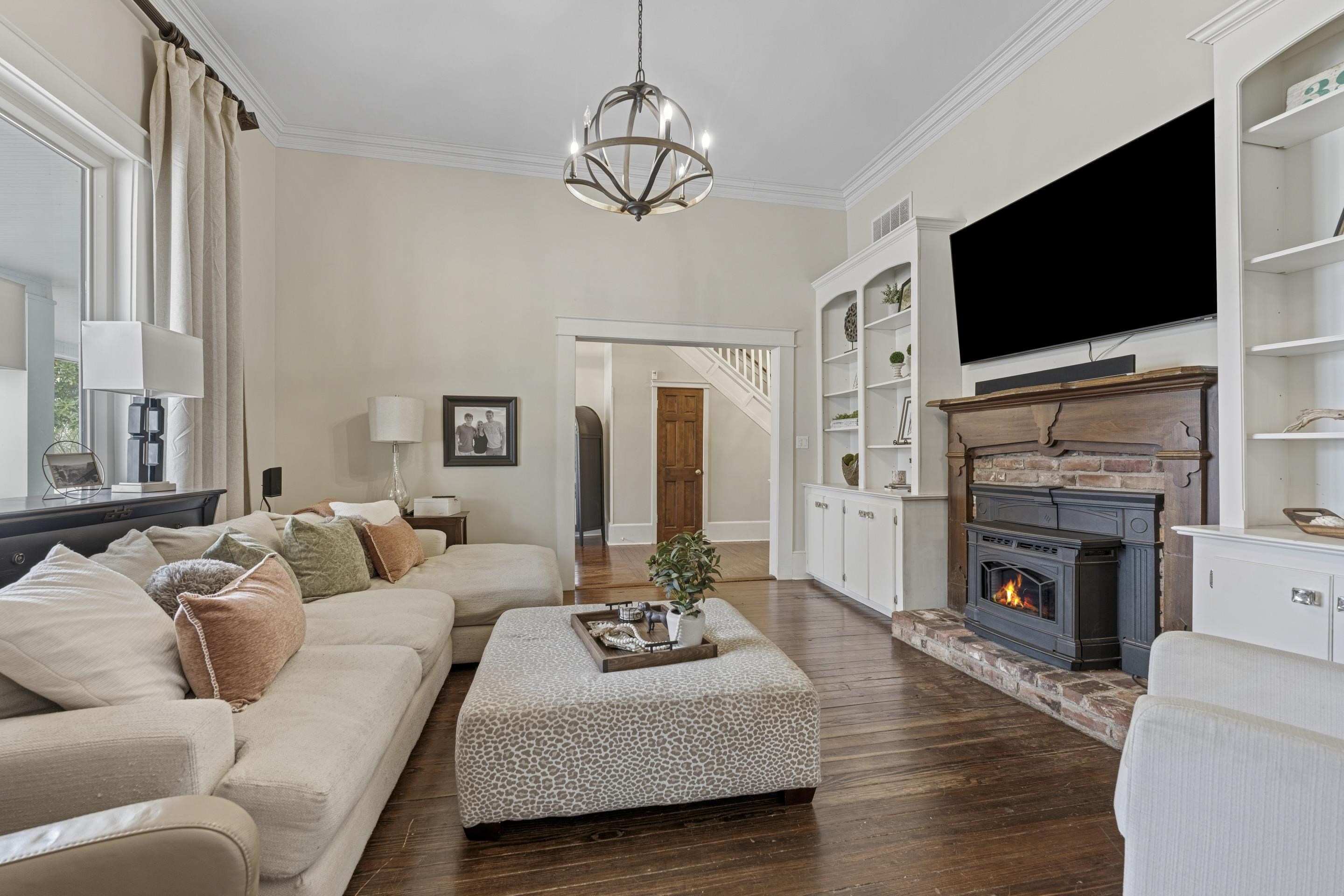 12601 Harrell Road Arlington, TN 38002 - Photo 7 of 40 a living room with fireplace furniture and a flat screen tv