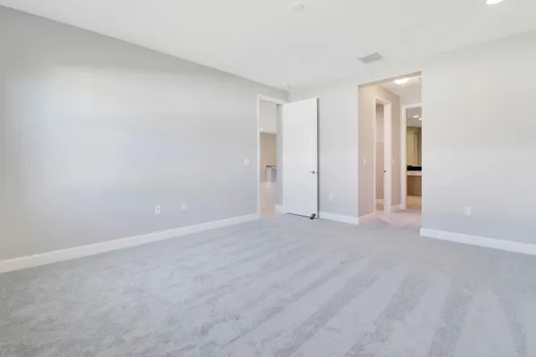 a view of a hallway view with wooden floor and staircase