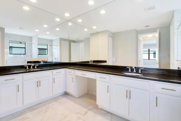 a kitchen with granite countertop a stove and a sink