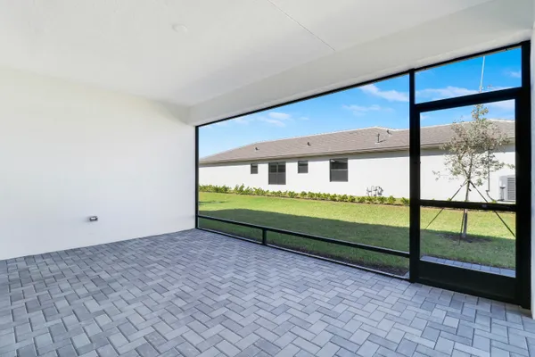 a view of a city with lawn chairs and large trees