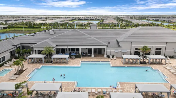 a view of a room with furniture and wooden floor