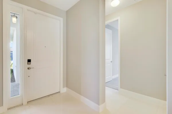 a view of an empty room with windows