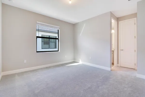 a view of an empty room and a windows