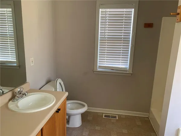 a kitchen with stainless steel appliances granite countertop a sink stove and microwave