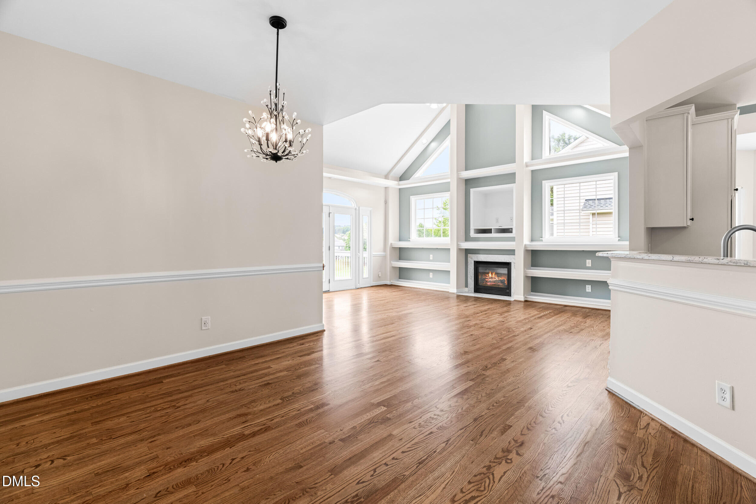 744 Seastone Street Raleigh, NC 27603 - Photo 11 of 53 a view of a kitchen with wooden floor and a kitchen
