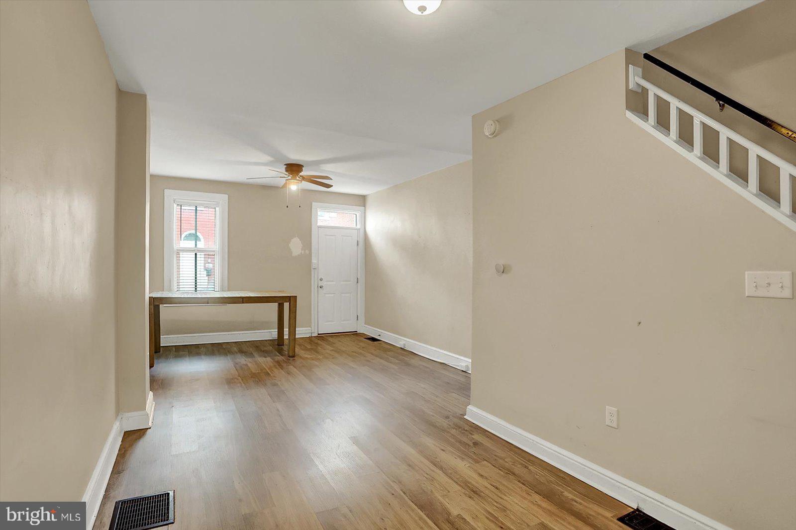 316 Beaver Street Lancaster, PA 17603 - Photo 9 of 34 a view of an empty room with wooden floor and a window