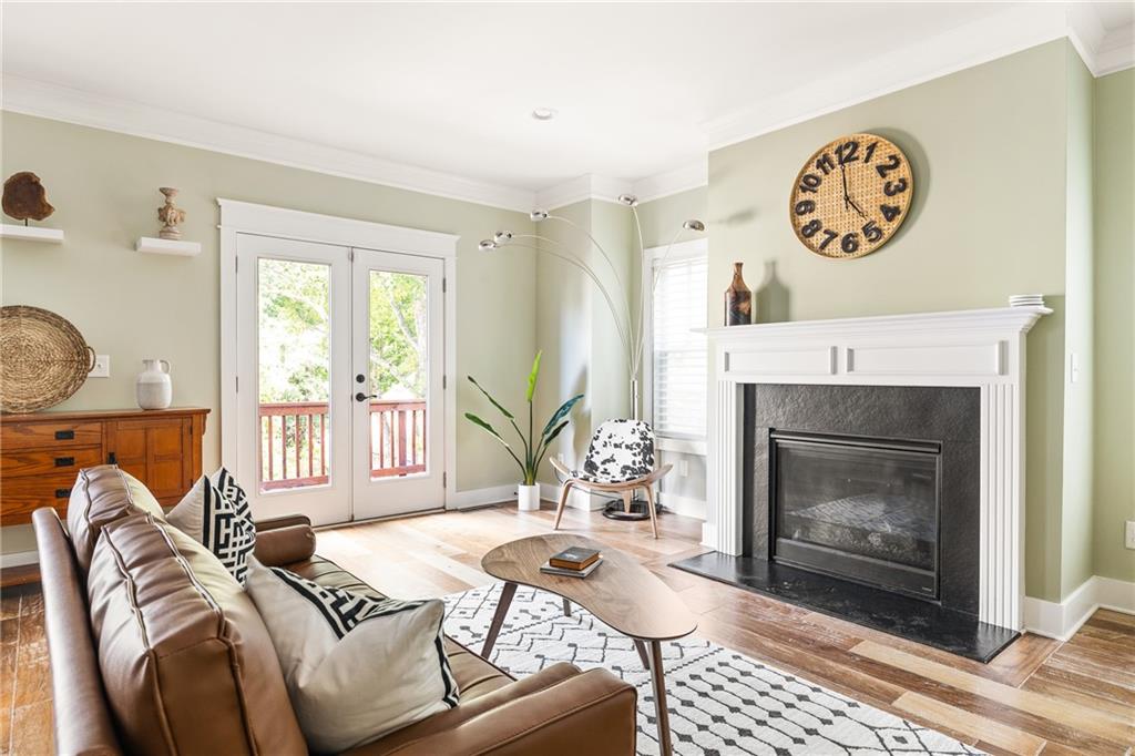1333 Oakview Road Decatur, GA 30030 - Photo 6 of 28 a living room with furniture a window and a fireplace