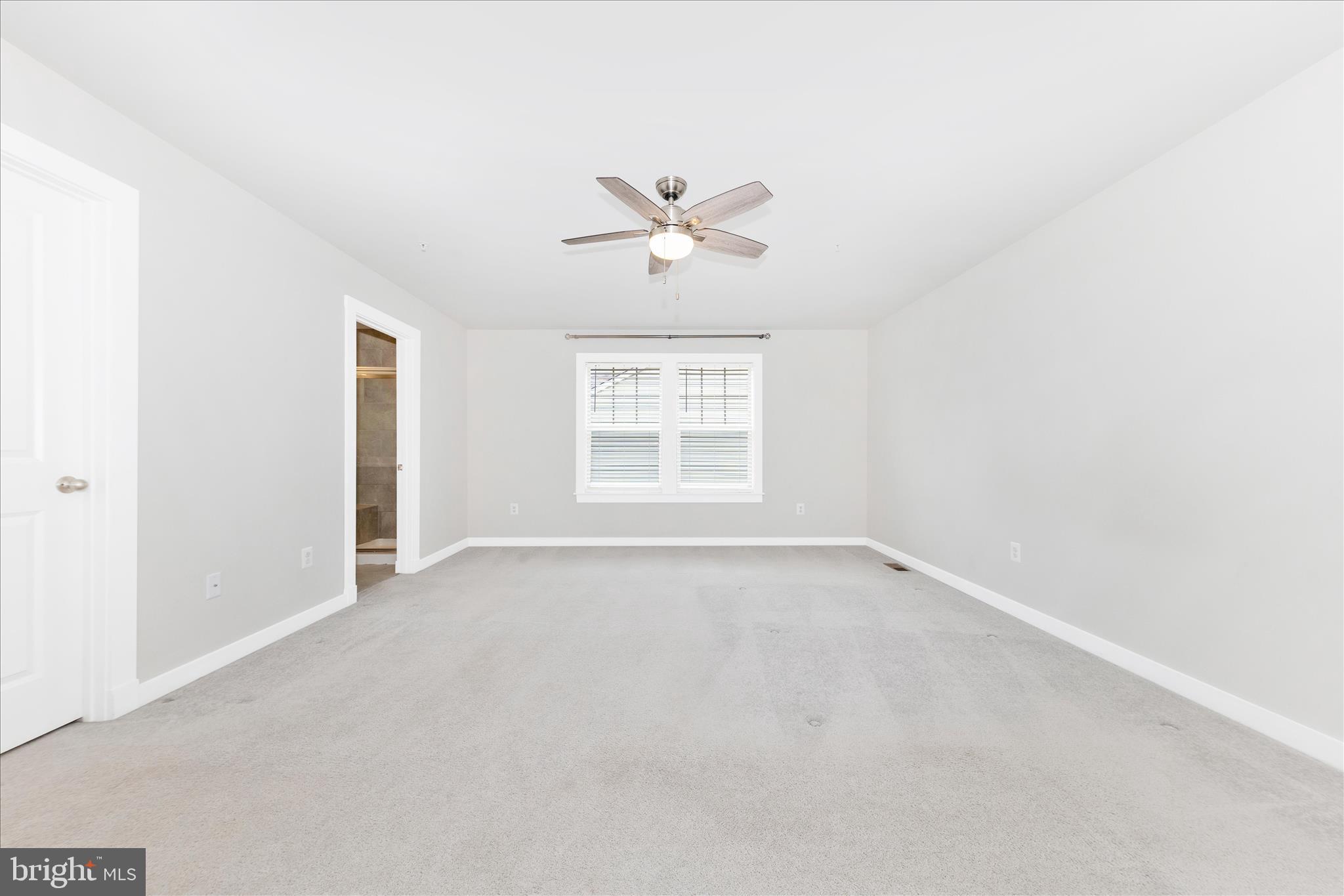 2003 Foster Way Frederick, MD 21702 - Photo 35 of 74 an empty room with a window and a ceiling fan