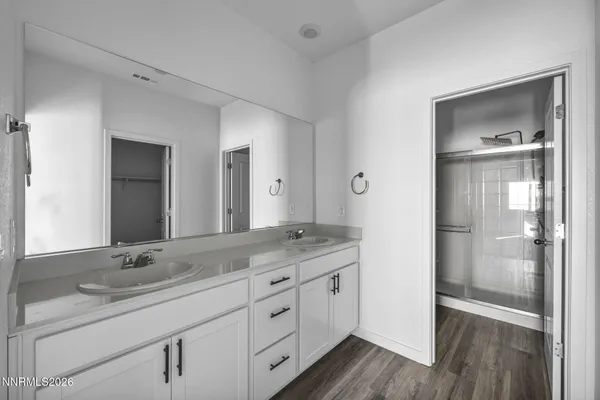 a bathroom with a granite countertop sink mirror and double