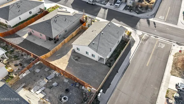 a view of empty room with wooden floor and window