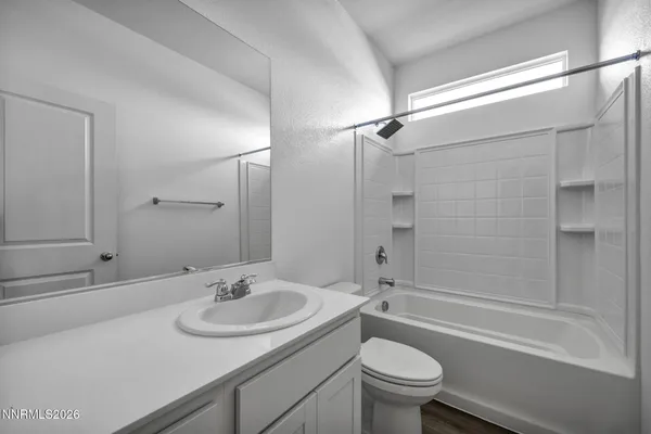 a bathroom with a tub and shower