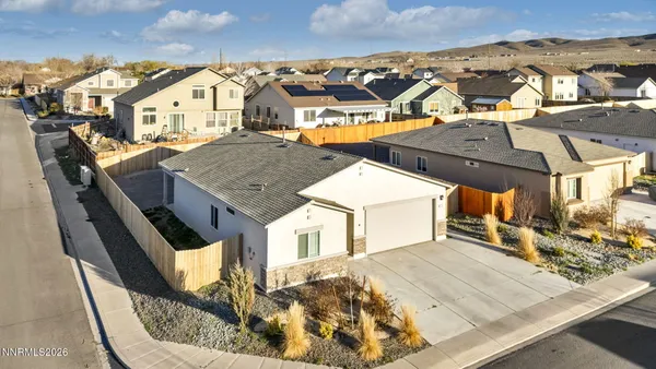 an aerial view of a house with a porch